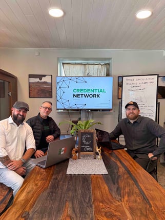 credential network founders sitting at a table